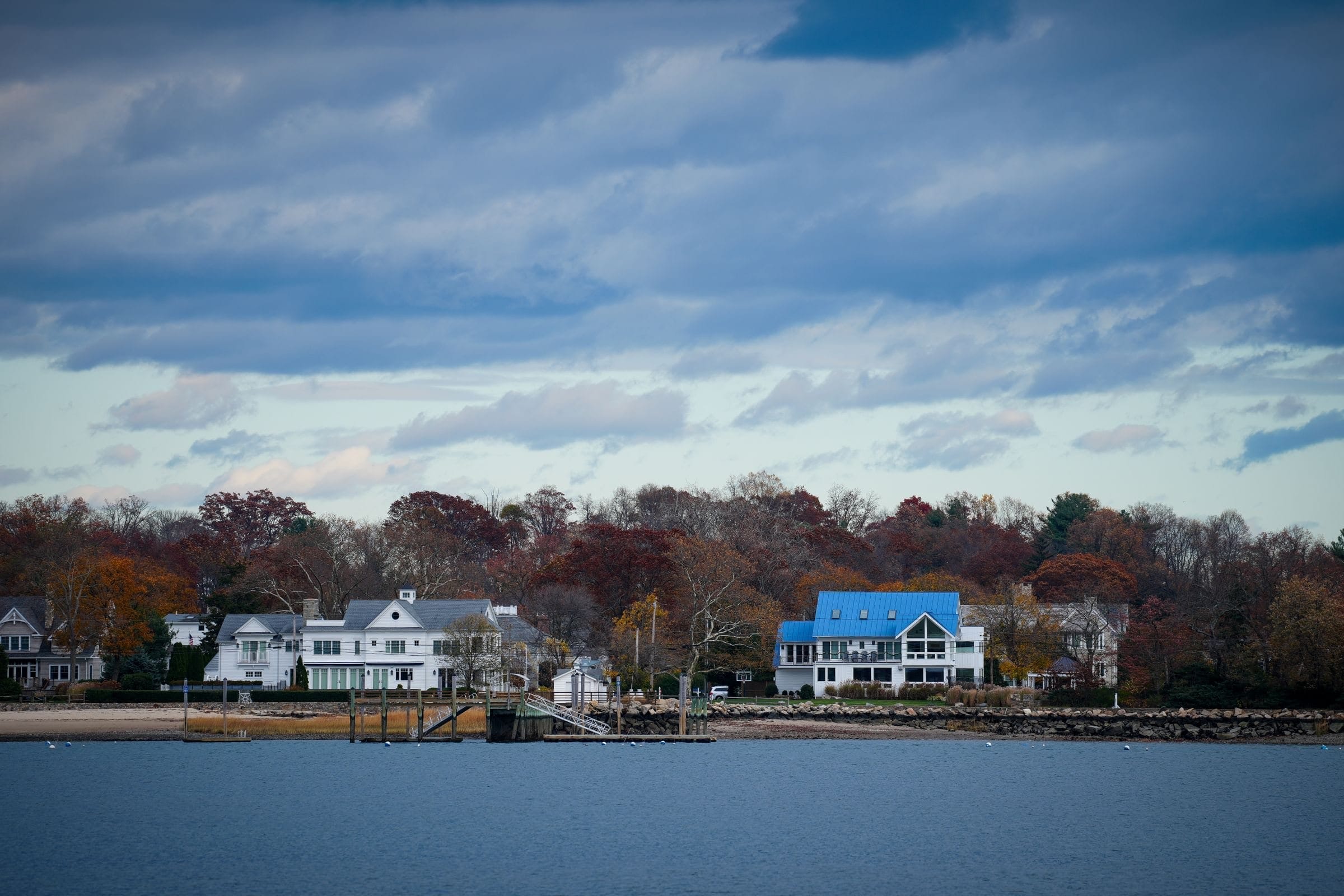 Darien, CT: waterfront homes and autumn trees along a Fairfield County shoreline
